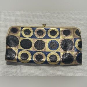 HOBO Circle Pattern Clutch in Black, Gold, and Blue